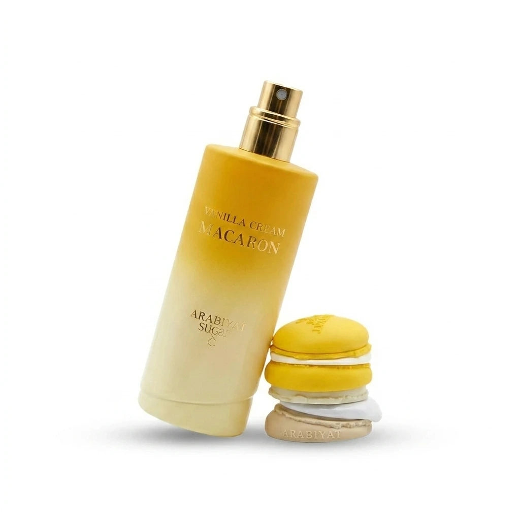 Clean product photography of the Arabiyat Sugar Vanilla Cream Macaron perfume bottle from image_5131c8.jpg. The tall gradient bottle is standing at a 45-degree angle with its gold spray nozzle exposed, and the yellow macaron cap is arranged neatly next to its base. Seamless pure white background (#FFFFFF) with a very soft, realistic light grey shadow underneath to anchor both elements. Minimalist catalog style. Aspect ratio 1:1, size 1200x1200px. (gemini-3-pro-image-preview)